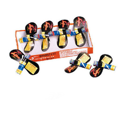 Sunflower W504 multi-color ground spinner — sun-shaped retail card with bright colored sparks